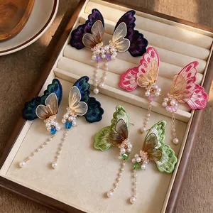 Exquisite handmade embroidered butterfly drop earrings with elegant pearls and long tassels.