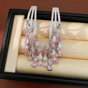 Detailed view of teardrop tassel earrings featuring elegant pink and white zircon stones