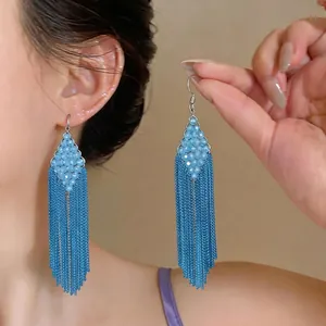 Elegant blue beaded tassel earrings featuring a diamond shape and long metal chain fringe