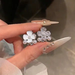 Elegant asymmetrical flower stud earrings with pearls and rhinestones