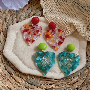 Elegant resin leaf earrings with colorful marbled texture and unique cutout details