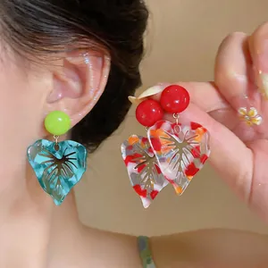 Vibrant tropical resin leaf earrings with marbled patterns and 925 silver needle studs