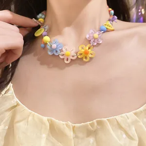 Detailed view of a colorful acrylic daisy choker necklace on a model in dopamine style.