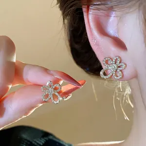 Elegant 18k gold plated zircon flower stud earrings for a sophisticated minimalist look.