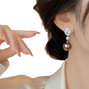 Elegant oval diamond-studded earrings with dark bronze pearl drops for women