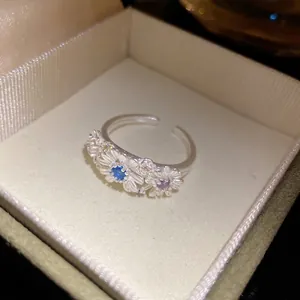 Elegant Korean style matte silver daisy ring with blue and purple crystal stones