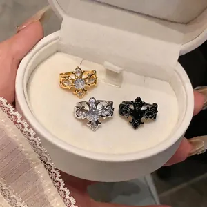 Elegant gothic zircon cross fleur-de-lis ear clips in gold, silver, and black colors