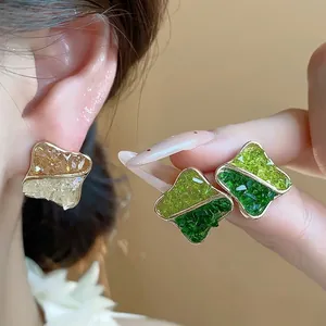 Elegant 14K gold plated geometric stud earrings with green and amber crushed glass