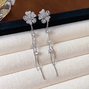 Elegant silver needle earrings with zircon flower design and long tassel drop style