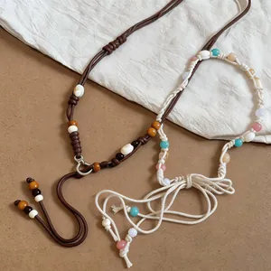Bohemian braided waist chains with colorful wood beads and shells, ethnic accessory detail
