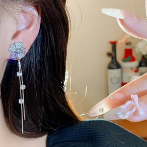 Exquisite silver needle zircon flower tassel earrings featuring sparkling stone details and long chains