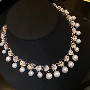 Macro view showing the sparkle of rhinestones and luster of pearls on this necklace