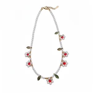 Sweet white pearl beaded necklace with dainty daisy flower and vibrant green leaf charms