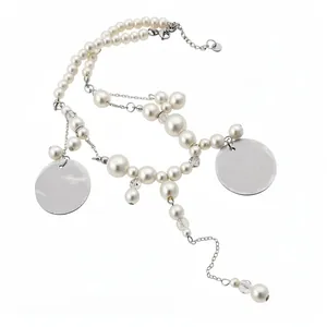 Elegant resort-style white pearl beaded necklace with silver-tone circular pendants
