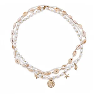 Boho pearl and shell waist chain with starfish pendants for beach vacation style