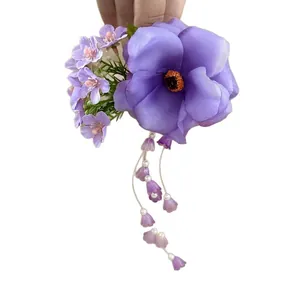 Elegant purple silk flower hair clip featuring long pearl tassels for stylish updo hairstyles