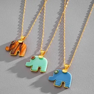 Elegant resin elephant pendant necklaces in brown, green, and blue with gold chains.