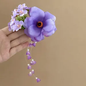 Handcrafted purple silk flower hair clip featuring elegant long floral and pearl tassel fringe