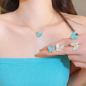 Detailed close-up view of the elegant blue resin and zircon butterfly necklace and earrings