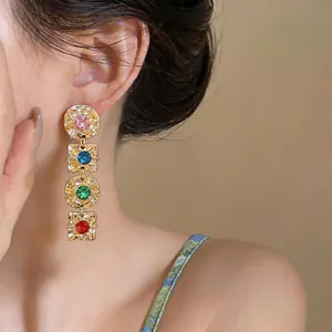 Elegant vintage style drop earrings with colorful crystals and geometric gold frames