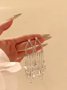 Elegant silver waterdrop tassel earrings with shimmering crystals for luxury style
