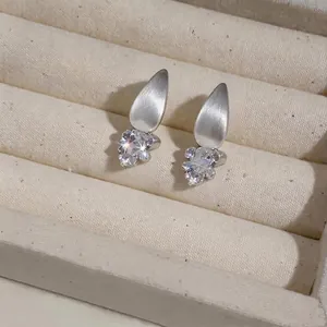 Minimalist matte silver teardrop stud earrings with sparkling clear zircons