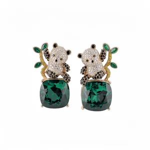 Exquisite panda stud earrings with large square green gemstones and bamboo details