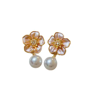 Vintage French style gold flower stud earrings with elegant drop pearls and pink enamel petals