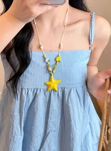 Close-up of dopamine colorful beaded necklace with yellow starfish pendant for summer