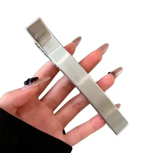 Large minimalist silver metal duckbill hair clip with premium brushed texture finish