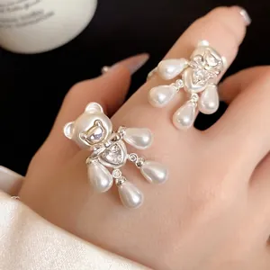 Romantic bear-shaped open ring featuring white pearls and heart-shaped zircon stones.
