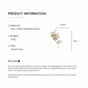 Detail view of a fabric flower hair clip with pearl tassel and product dimensions.