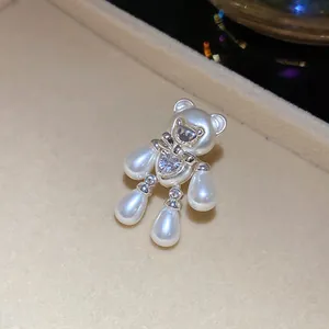 Exquisite detailed macro shot of a pearl bear jewelry charm featuring a sparkling zircon heart