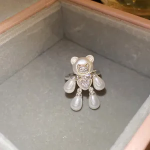 Detailed view of a charming bear-shaped open ring featuring elegant pearls and zircon