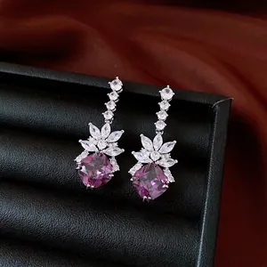 Vintage silver needle earrings with purple zircon rhombus drops and floral crystal accents