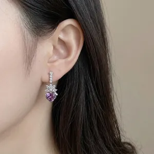 Vintage silver-toned earrings with purple cushion-cut zircon and clear crystals