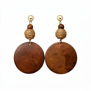 Ethnic vintage style round wooden pendant earrings with raffia woven beads and golden studs