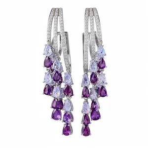 Luxury 18k gold plated silver earrings featuring vibrant purple zircon teardrop tassels