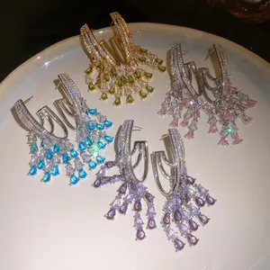 Detail view of multi-color zircon tassel earrings with brilliant pear-shaped stones