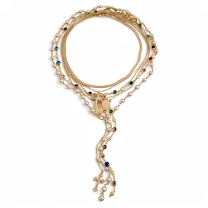 Elegant layered gold necklace with pearls, colorful crystals, and cross pendants for women