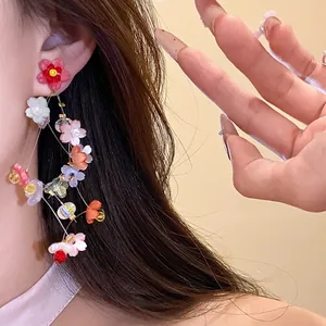 Sweet resin flower tassel earrings with silver needles, elegant vacation style jewelry.