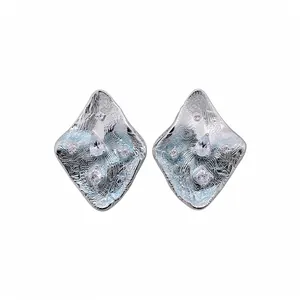 Elegant silver-toned wrinkled rhombus stud earrings with sparkling cubic zirconia