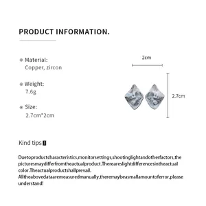 Detail view showing the dimensions and material of silver wrinkled rhombus earrings
