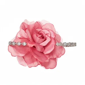 Elegant pink fabric mesh rose hair clip with sparkling crystal rhinestones on a silver base