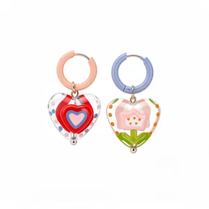 Colorful dopamine-style heart glass earrings with floral motifs on pastel hoops for women.