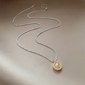 Detail of sparkling eight-pointed star pendant with zircon set on a silver twisted chain