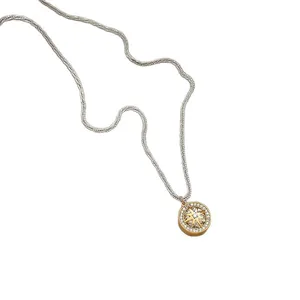Elegant eight-pointed star pendant necklace with sparkling zircons on a white background