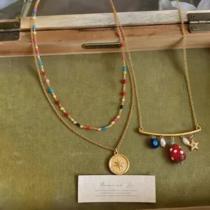 Vintage sweet gold necklace set with colorful beads, star pendant and strawberry charms
