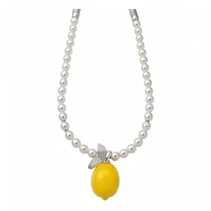 Elegant pearl beaded necklace featuring a vibrant yellow lemon pendant with zircon leaves.