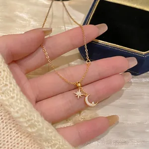 Elegant 18k gold plated collarbone chain featuring zircon encrusted star and moon charms